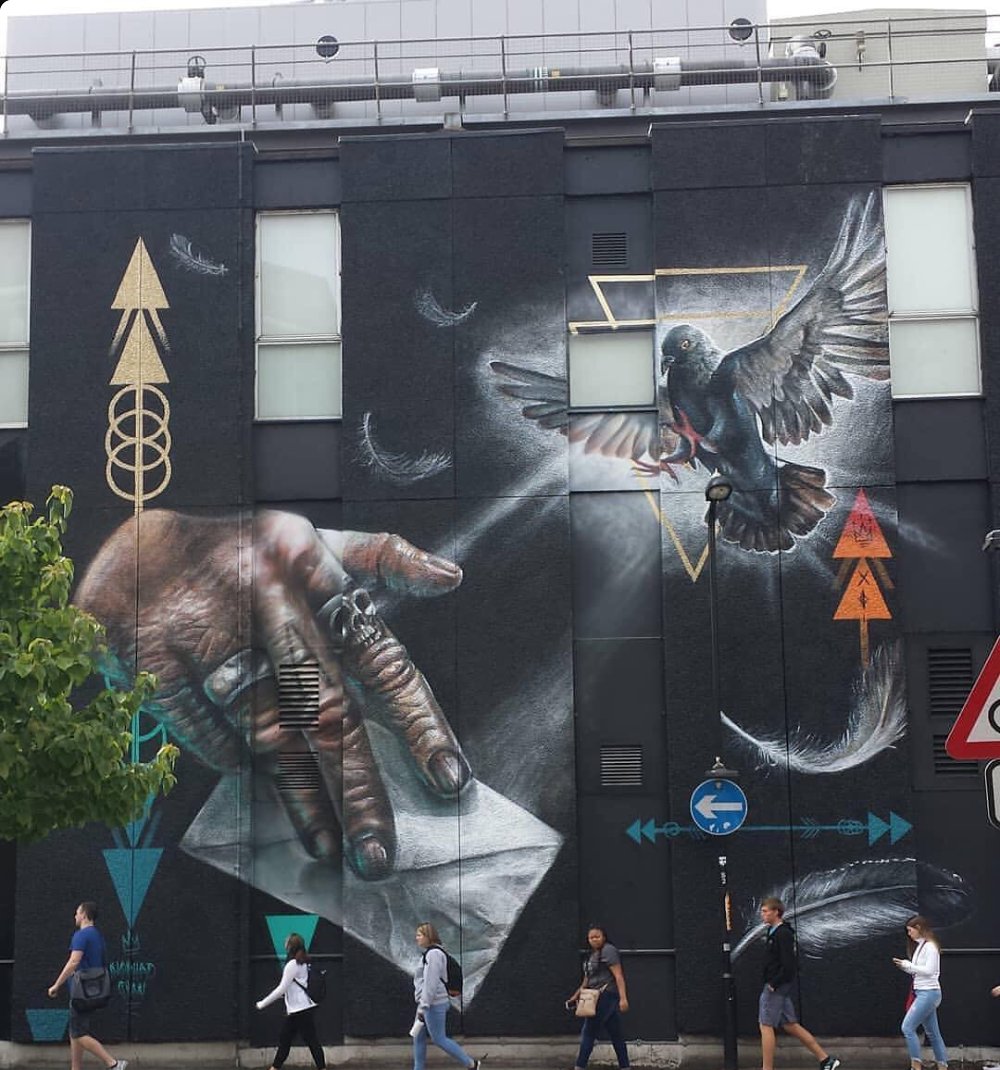 PoliceBizz's tweet photo. SYMBOLISM. This work by Nomad Clan, the fab female duo, Joy Gilleard (Cbloxx) and Hayley Garner (AYLO) is loaded with religious symbols.DEATH. PEACE. REVELATION. Or is it? It’s all in the eye of the beholder.
#amwriting
#streetart
#indieauthor
#writerslife https://t.co/1DchZii1lC