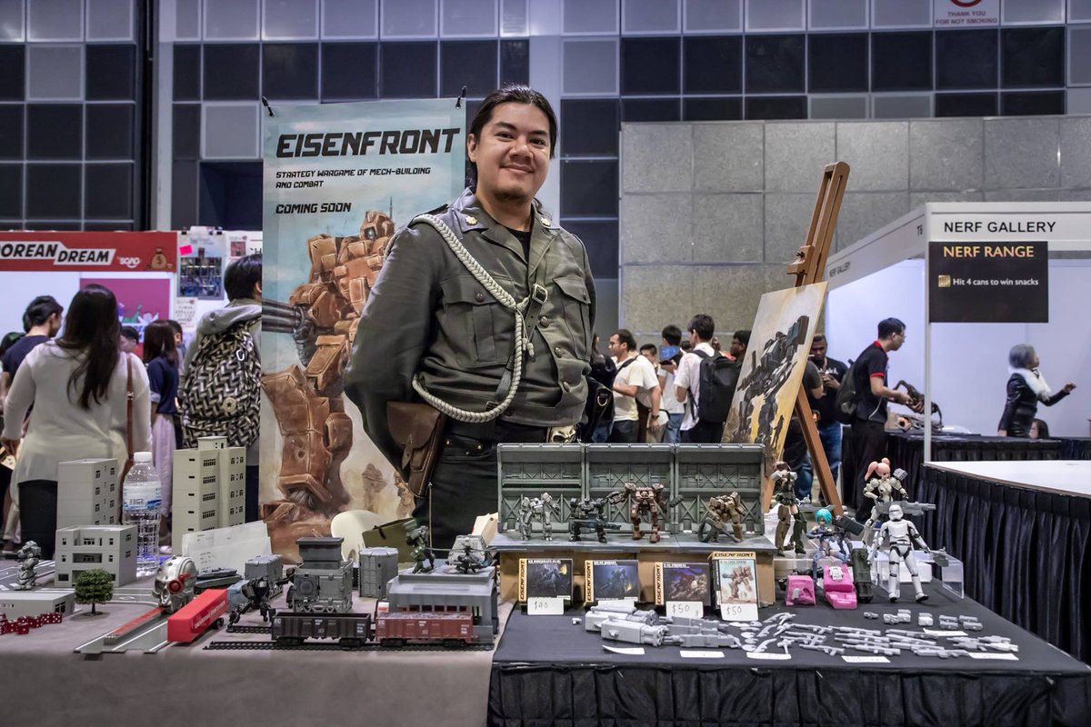 SeanSuchanya's tweet photo. A shot of my booth at gamestart. Day 1 was a complete freakkin disaster due to my booth location being blocked by a giant pillar. Day 2 was shifted to the center and had much better traffic. #indiegame #tabletopwargame #GameStart2018 #gamestart #gamestartsingapore #indietoy https://t.co/qUkYcOKR51