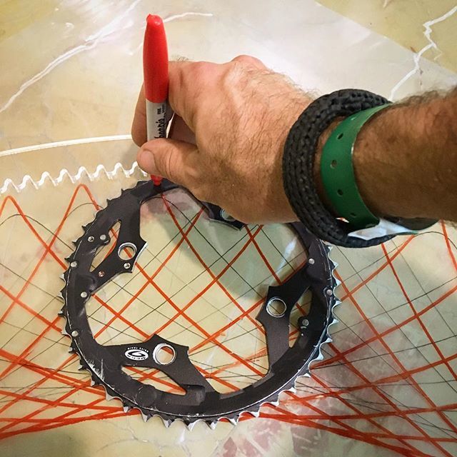 NickSayers's tweet photo. I’ve also made a 1-metre Bike Cog Spirograph wheel. 248 teeth! Drawing patterns with a 44-teeth bicycle chainring. The marble floor of the Hilton makes a nice smooth drawing surface. #GiantDrawingMachines #spirograph #hypotrochoid #birossart2018 https://t.co/DUtw9h161b https://t.co/l0P5yWmn0p