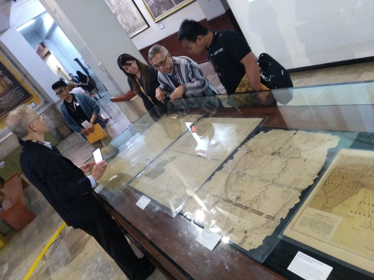 Some of the #IMCoS participants viewing the @ustmdblib small map exhibit. #TheUSTLibraryOnTheMap