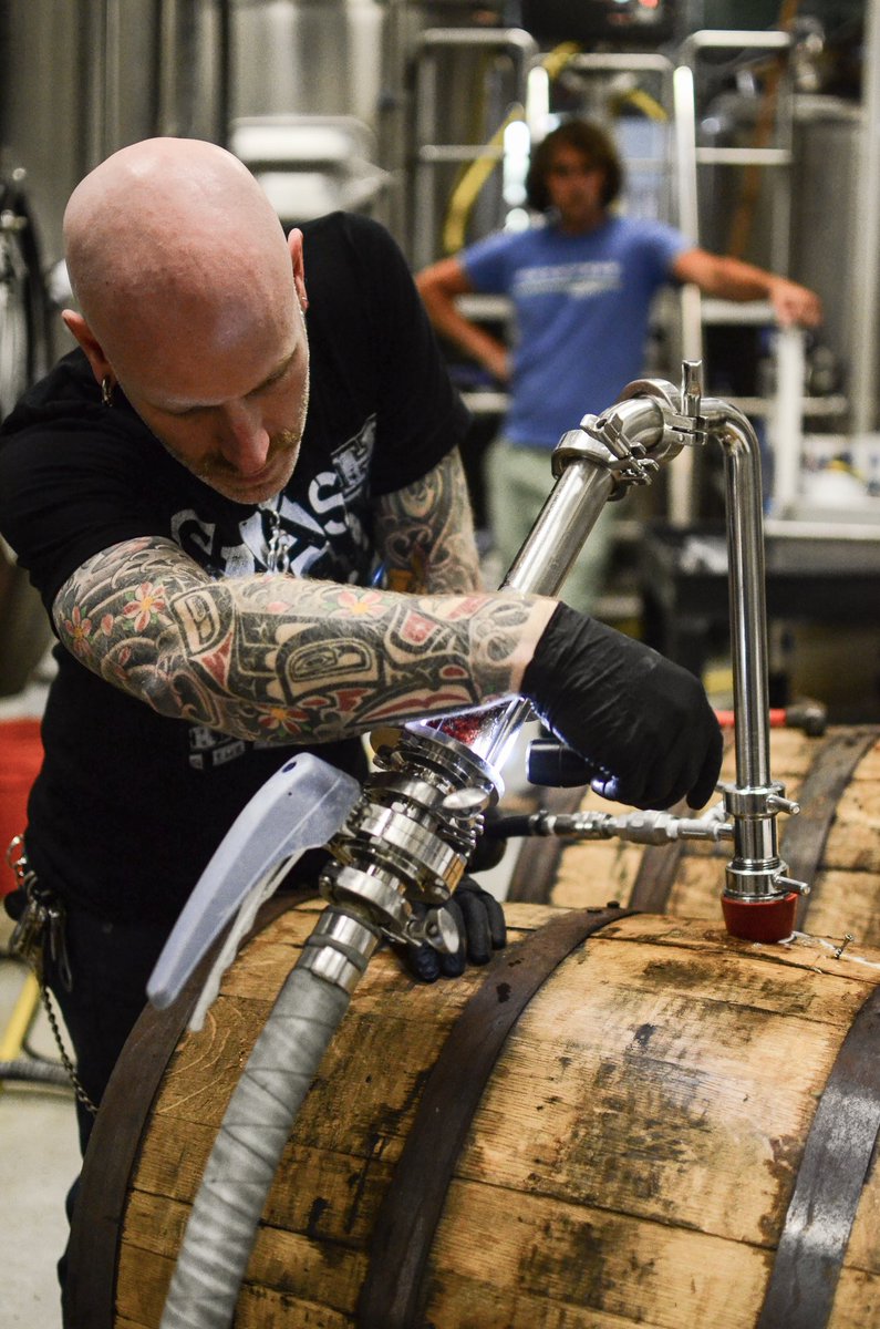 Watching the master at work. Wonder what he’s transferring… Any guesses? 🛢➡️🛢 #Julian #brewmaster #BarrelTransfer #WonderWhatItIs #AnyGuesses? #Dark #BarrelAged #ItCouldBeAnything #TisTheSeason #BeachwoodBrewing #TruetoBeer