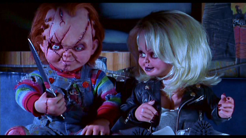 BRIDE OF CHUCKY *and* PRACTICAL MAGIC both turn 20 today, so your evening d...
