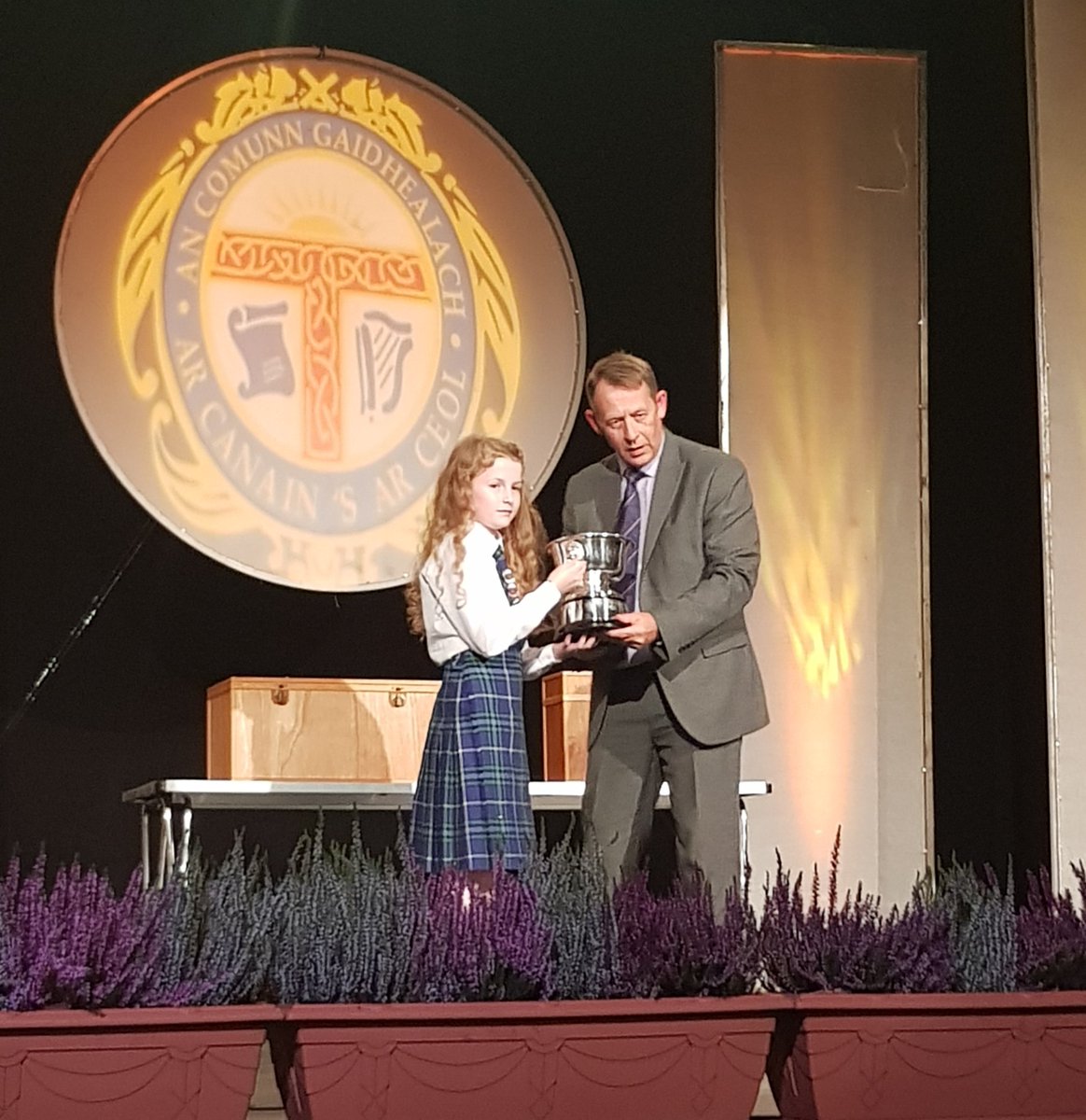 BlairMogliaCFL's tweet photo. Our very own David Cannon presenting the Susan Paterson memorial cup to the Sir E Scott school from Tarbert Harris!🏆 Huge congratulations to all the winners😊👍 @NationalMod #Mod2018 @CalMacFerries https://t.co/gpOLrtXTwc
