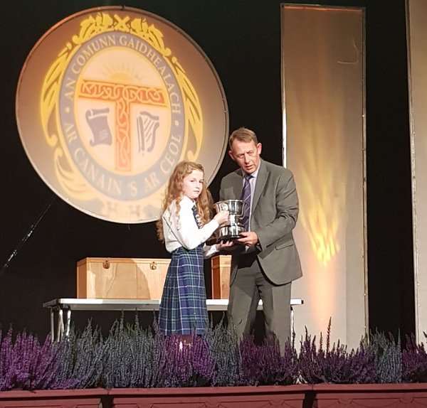 CalMacFerries's tweet photo. Here is David Cannon presenting the Susan Paterson @NationalMod memorial cup to the Sir E Scott school from Tarbert, Isle of Harris!🏆 Huge congratulations to all the winners😊👍 #Mod2018 https://t.co/3TwfIlHvc7