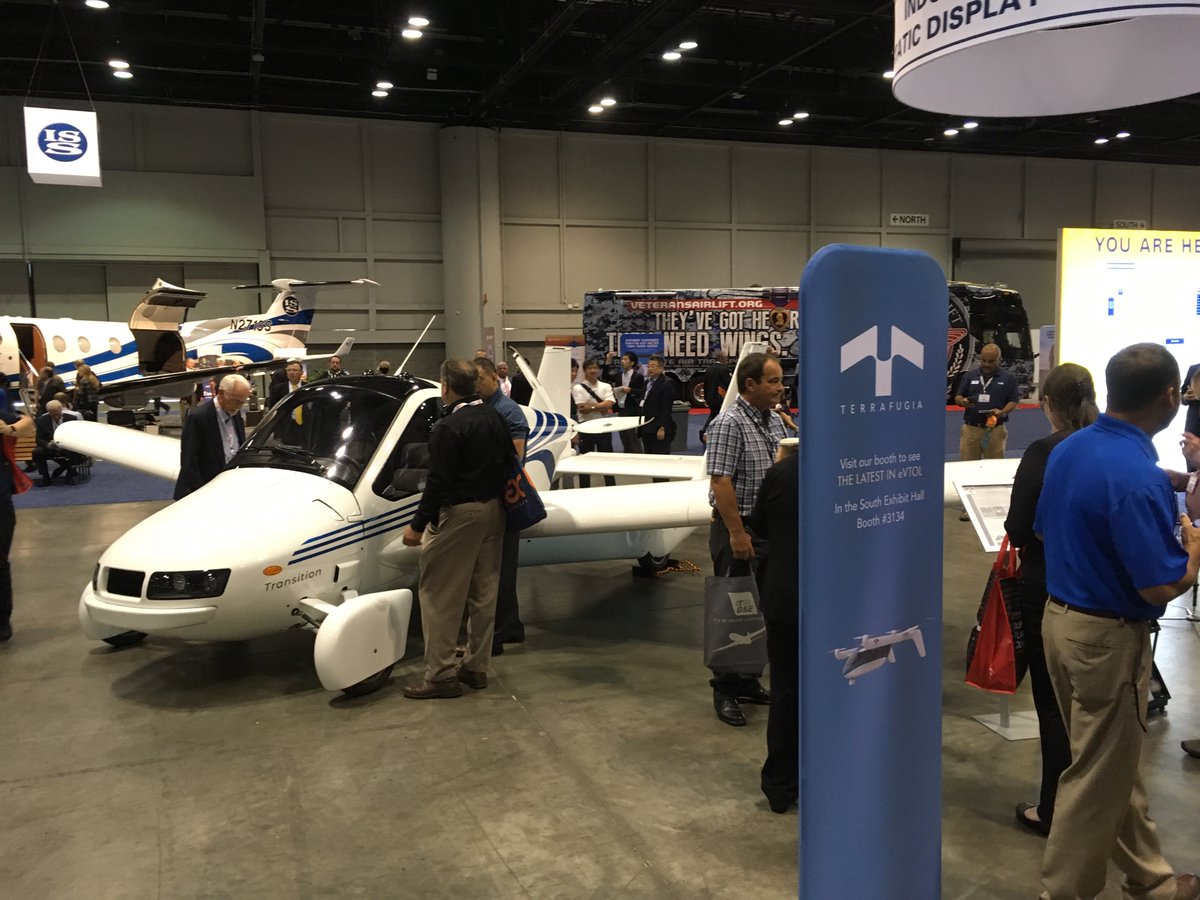TerrafugiaInc's tweet photo. Donβt forget to stop by the indoor static display area at #NBAA18 to see the #Terrafugia Transition. The Transition is scheduled to begin production in 2019. #DrivenToFly #FlyingCars #transportation #mobility #geely #aviation #lightsportaircraft #aircraft #pilots #transition https://t.co/k8XCyQXio8