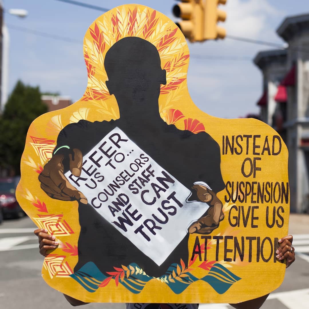 OurTurnNatl's tweet photo. STOP 👏🏿 CRIMINALIZING 👏🏾 US 👏🏽
#PerformingStatistics: "Last year, Richmond PS suspended < 20% of African American students & 25% of students w disabilities. We're asking for #SolutionsNotSuspensions #CounselorsNotCops & #SchoolsNotPrisons.
Art: @k8deciccio
📷: mark strandquist https://t.co/97ks5i4UCB