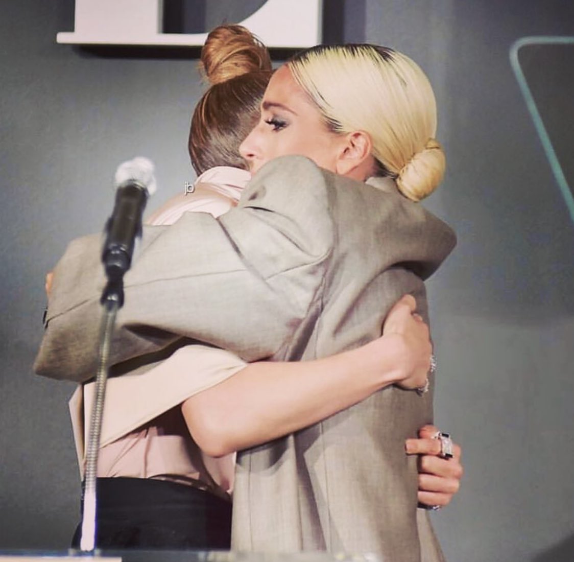 JLo's tweet photo. Women supporting women!! Love this moment of me giving beautiful @ladygaga her award as she is honored at #ELLEWIH!! Such an inspiring night! So proud to be a part of this community of powerful artists and trailblazers!!! #strongertogether #astarisborn #secondact #limitless https://t.co/XhjJktWsak