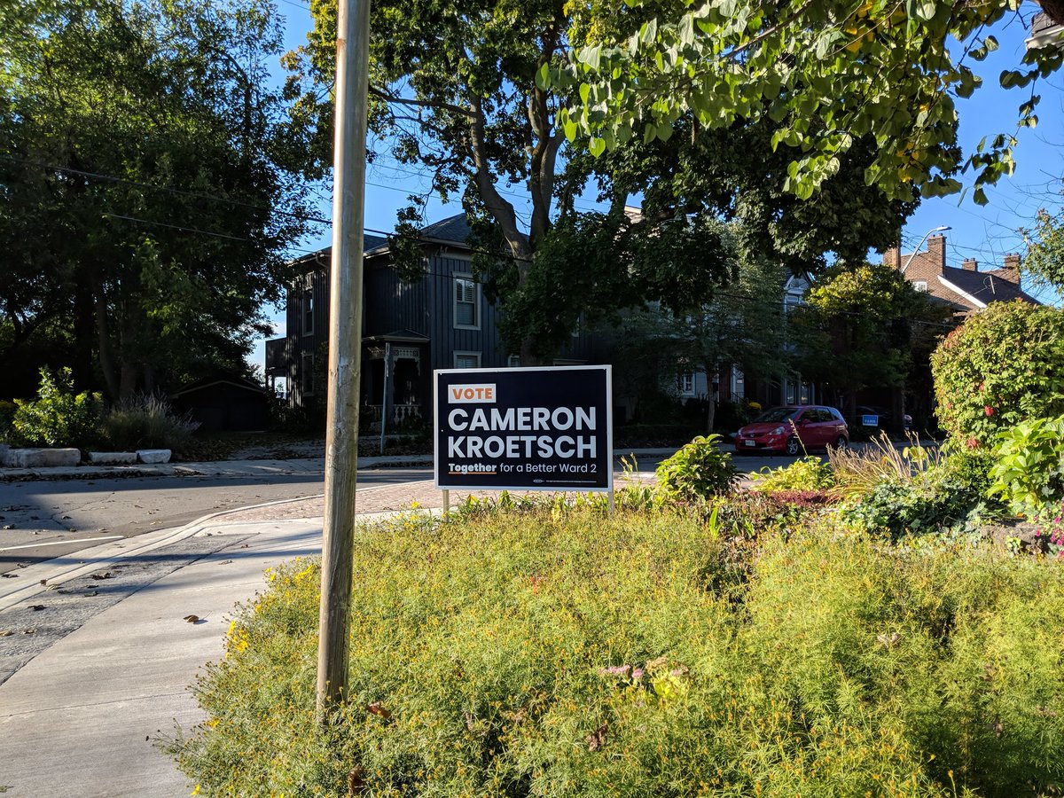 CameronKroetsch's tweet photo. Kate, Bayan, and I had a great time installing signs. Here's some of our handiwork around the North End (and a bonus Halloween boo!). #HamOnt #CameronForWard2 https://t.co/eJjDSnKKsq