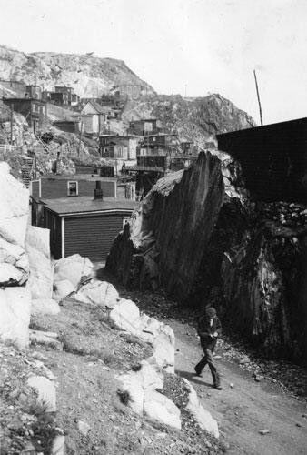 Man walking through The Battery, c. 1939. Photo by Gustav Anderson.