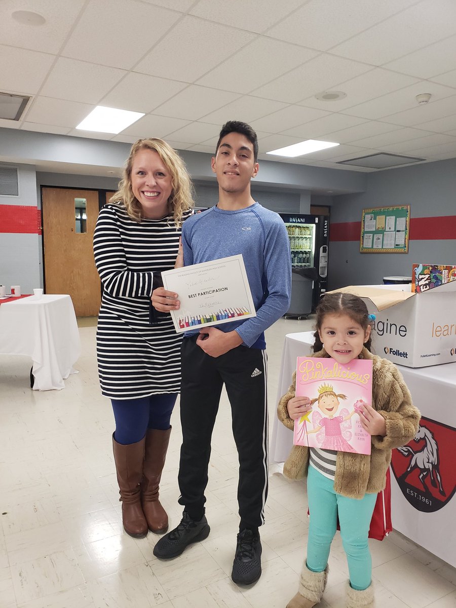 JustReadBehrens's tweet photo. Congrats to Yahir! He won the participation award, and his little sister deserves an award for her cuteness! #mundypride #justread #literacyfair https://t.co/rW3uFkbIs3