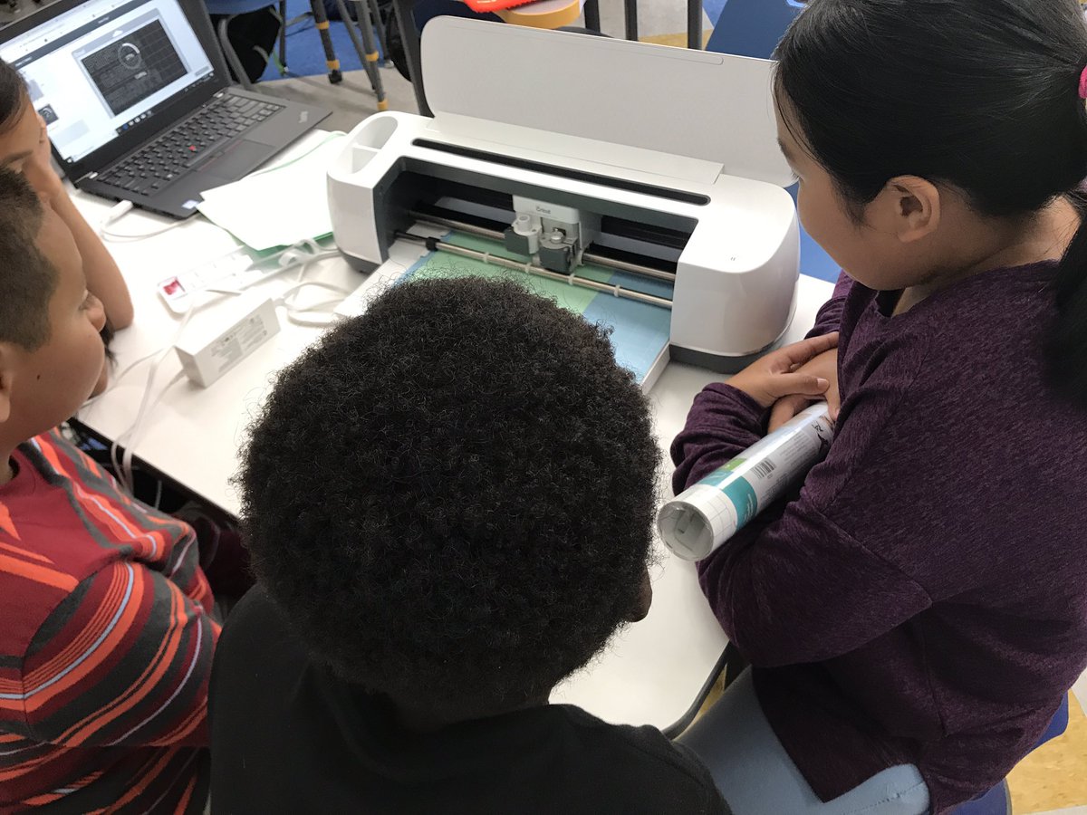 MsSpafford's tweet photo. Some of my students learning how to use the cricut during our #MVmakerspace time! Best part of my day- hands down! #STEAM #makeitfun #MVbees https://t.co/Rp7RtHn3Z6