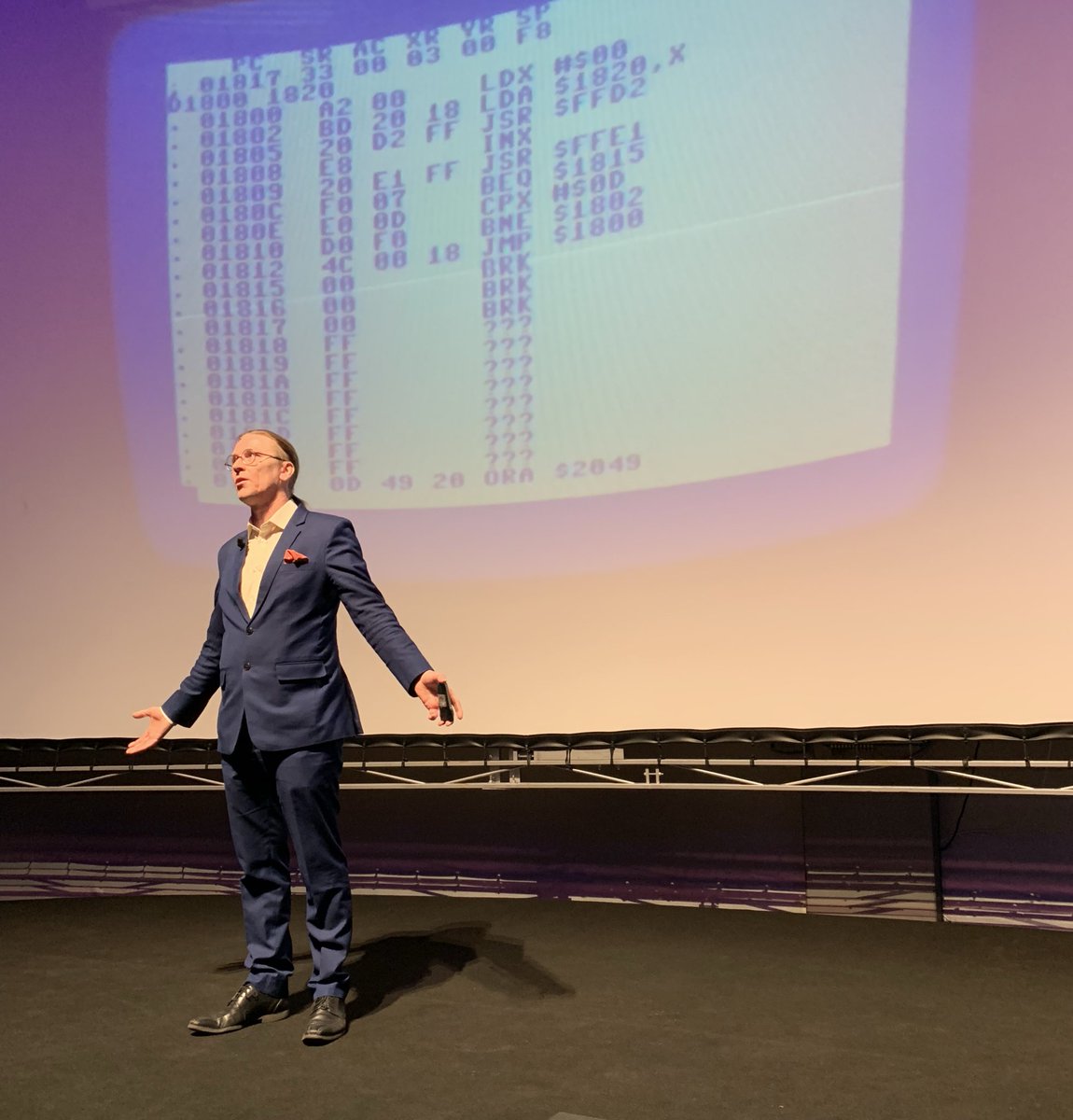 heisec's tweet photo. @mikko von F-Secure hält die Keynote auf der heise devSec. Im Hintergrund der Maschinencode seines ersten selbst geschriebenen Computerspiels für den C64 #devsec18 https://t.co/wPV00JKXnb