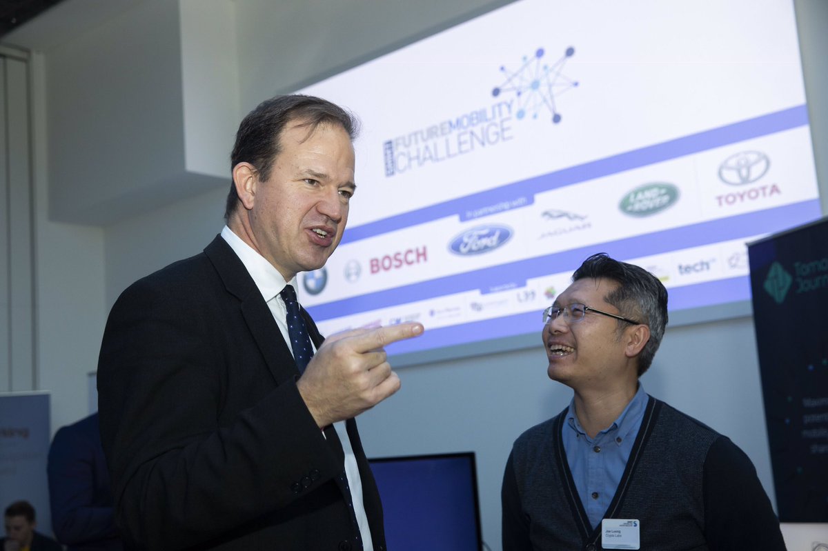 SMMT's tweet photo. Future Mobility Minister @Jesse_Norman talks to exhibitors at the SMMT #FutureMobilityChallenge about their automotive innovation and mobility solutions https://t.co/piIiN4qh0t https://t.co/wCRjNVQ2rZ