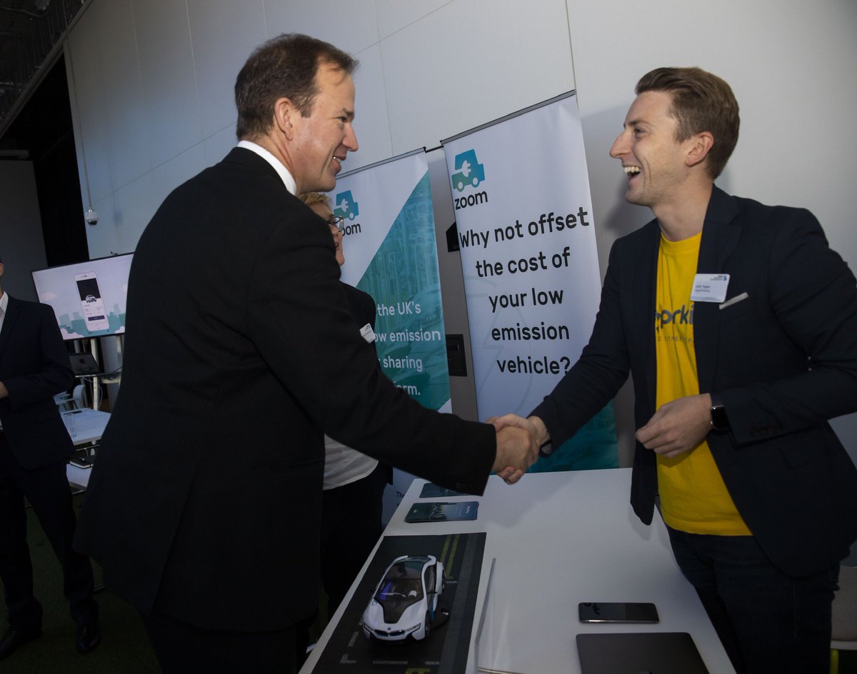 SMMT's tweet photo. Future Mobility Minister @Jesse_Norman talks to exhibitors at the SMMT #FutureMobilityChallenge about their automotive innovation and mobility solutions https://t.co/piIiN4qh0t https://t.co/wCRjNVQ2rZ
