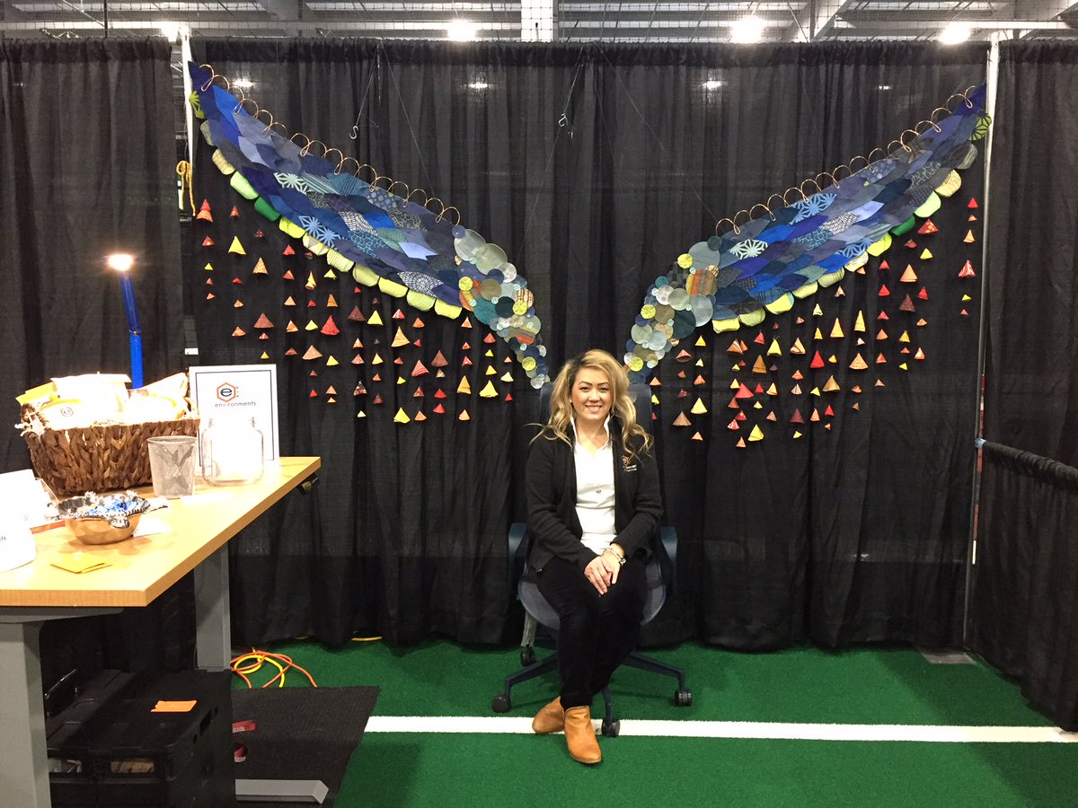 Environments1's tweet photo. @LXVID and @WhitTreu had a blast at the Eau Claire Chamber Business Expo yesterday! Check out the colorful wings our Interior Designer, Andrea, made for our back drop! #ECBizExpo2018 https://t.co/NHEJz568L7