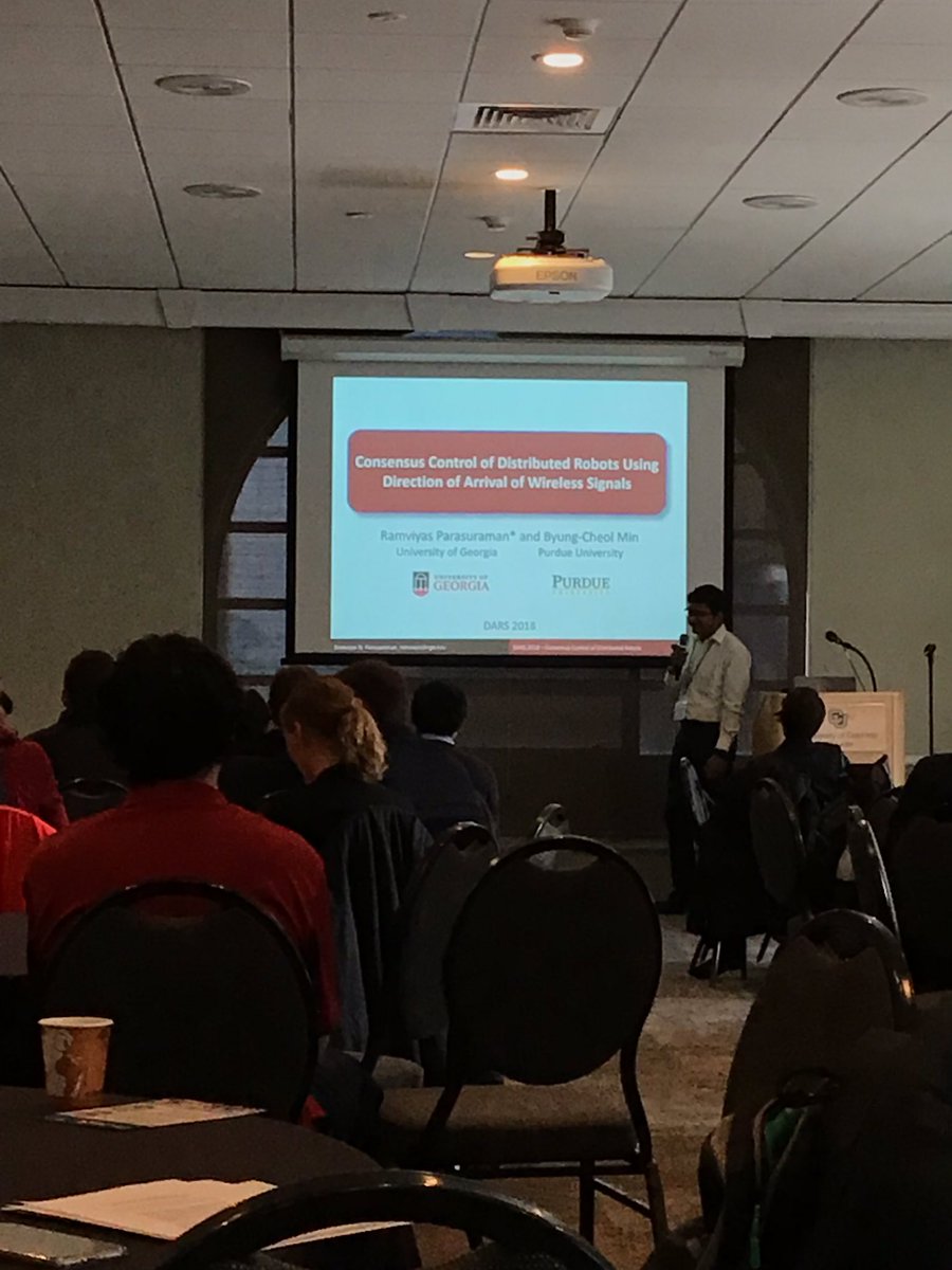 DARS2018Boulder's tweet photo. Ramviyas Parasuraman from @UGA-Athens shows #DARS2018 that wireless signal arrival direction can be used to achieve weighted bearing-based consensus. This is a useful angle on the problem. https://t.co/ElQ8jrzjhq