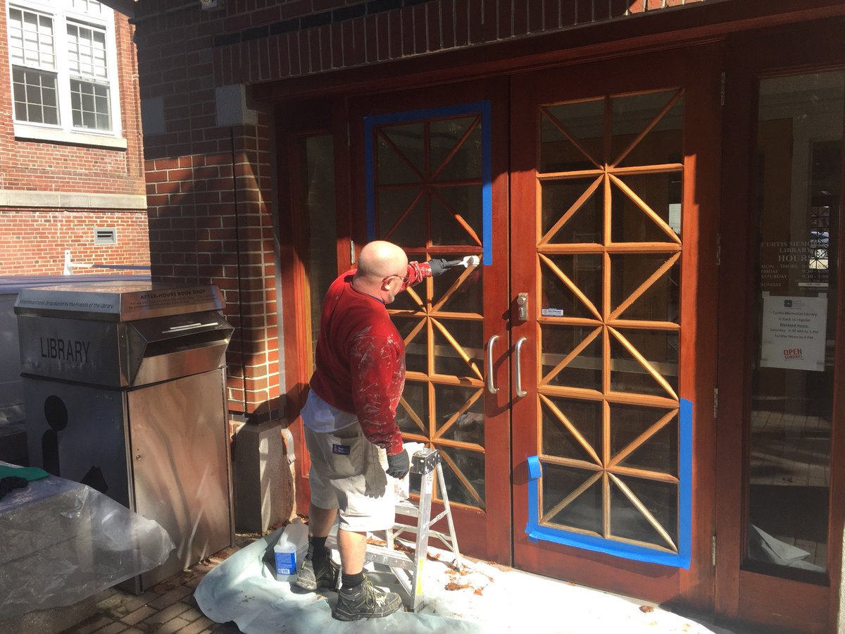 curtislibrary's tweet photo. Ernest O'Connor of New England Traditional Painting Company is doing the time consuming job of refinishing the doors. NOTE: This project is entirely funded by a generous donor from Harpswell. https://t.co/tmEVFoIwoK