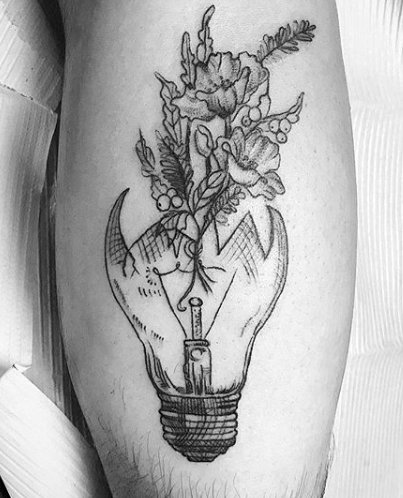 A black tattoo of a lightbulb filled with flowers. Inked on the right  forearm | Lightbulb tattoo, Tattoos, Small tattoos