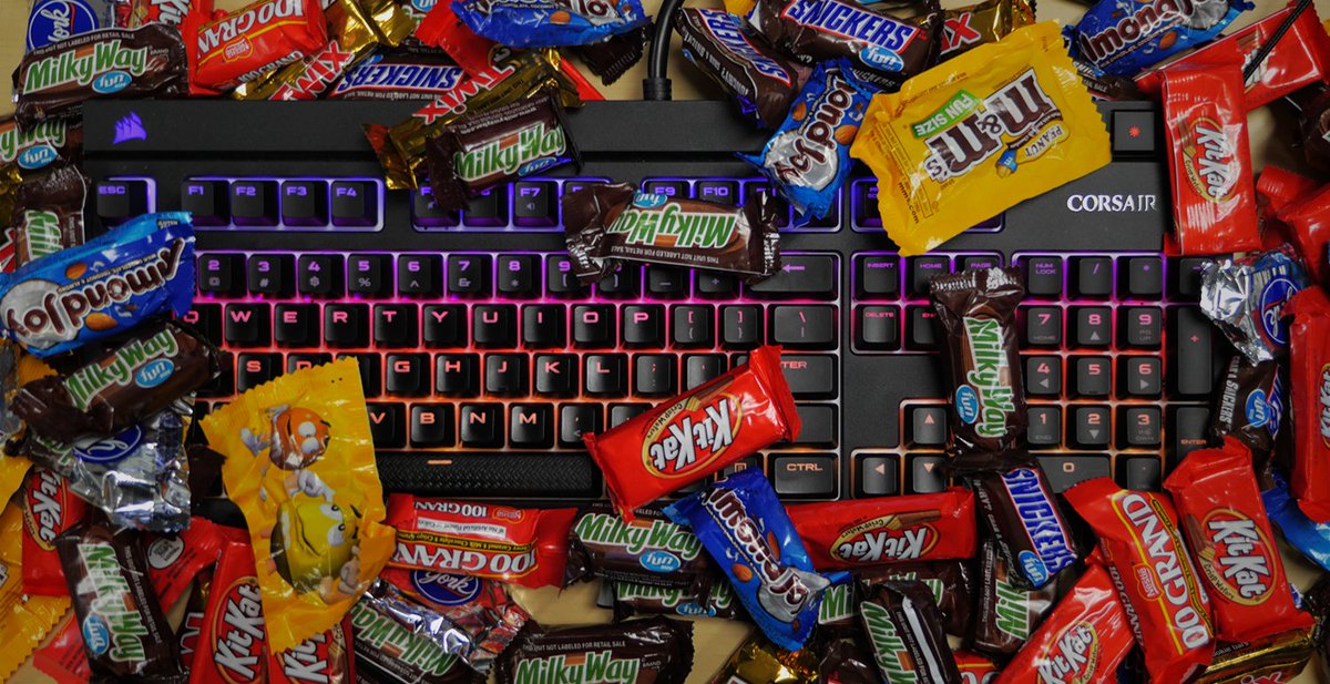 CORSAIR's tweet image. Which would you grab - all the candy or the keyboard?