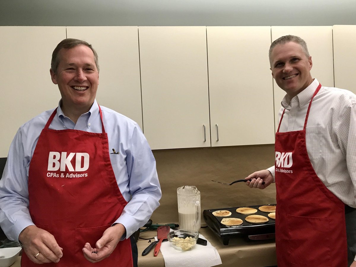 ForvisMazarsUS's tweet photo. BKDers do breakfast right! CEO @TedDickman works with John Gamble to create some perfectly fluffy pancakes. The breakfast is part of a weeklong campaign to raise funds for @UnitedWayOzarks. #BKDGivesBack https://t.co/0fTLzIqIhg