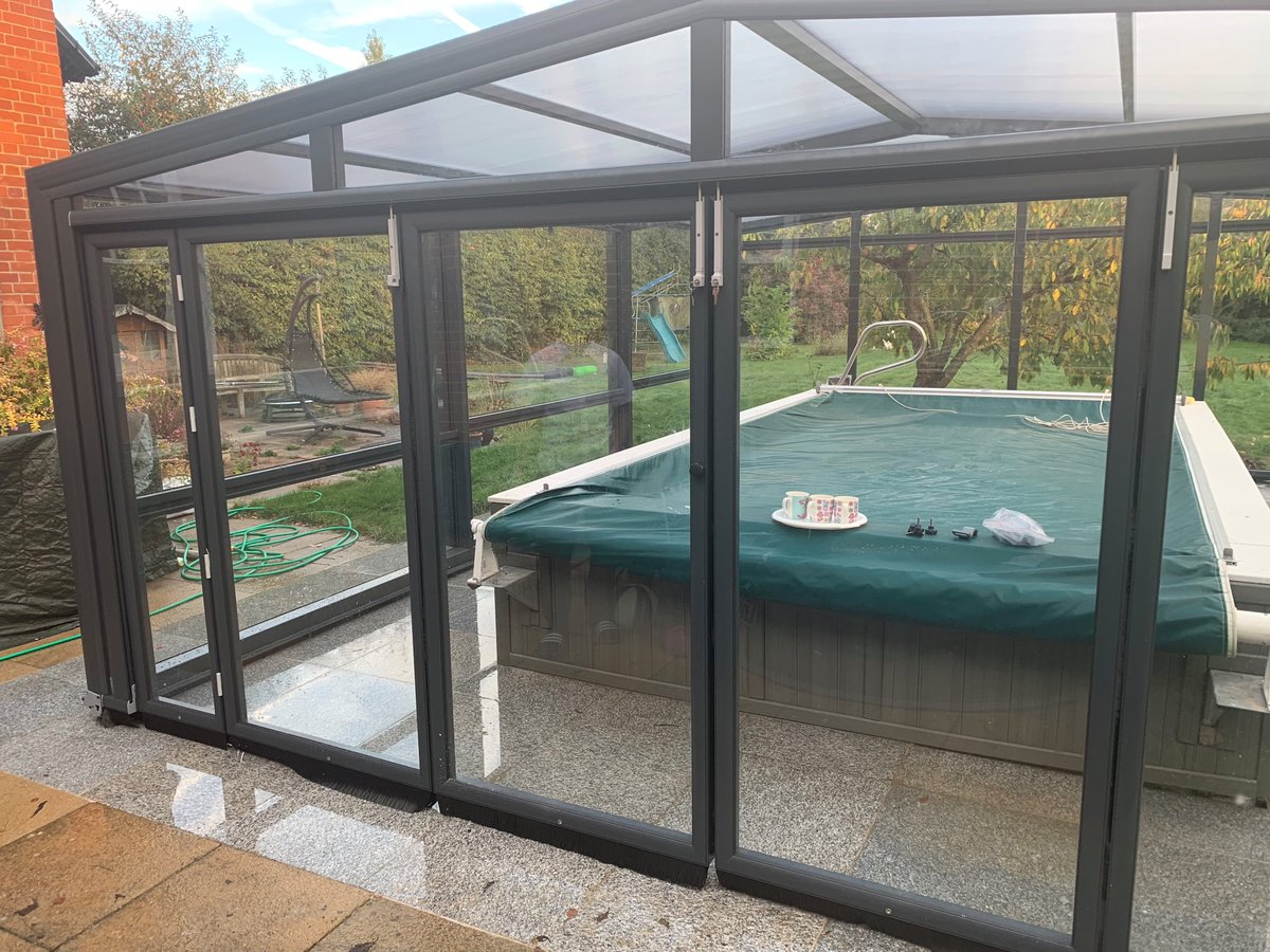 SummitLeisure's tweet image. A cute retractable glass sliding cover now providing a shelter for this pool. The bifold doors open up to provide great ventilation when needed. Rolling back off the pool to provide an open air pool when the weather is good. #endlesspool #poolcover #poolsafetycover #exercisepool