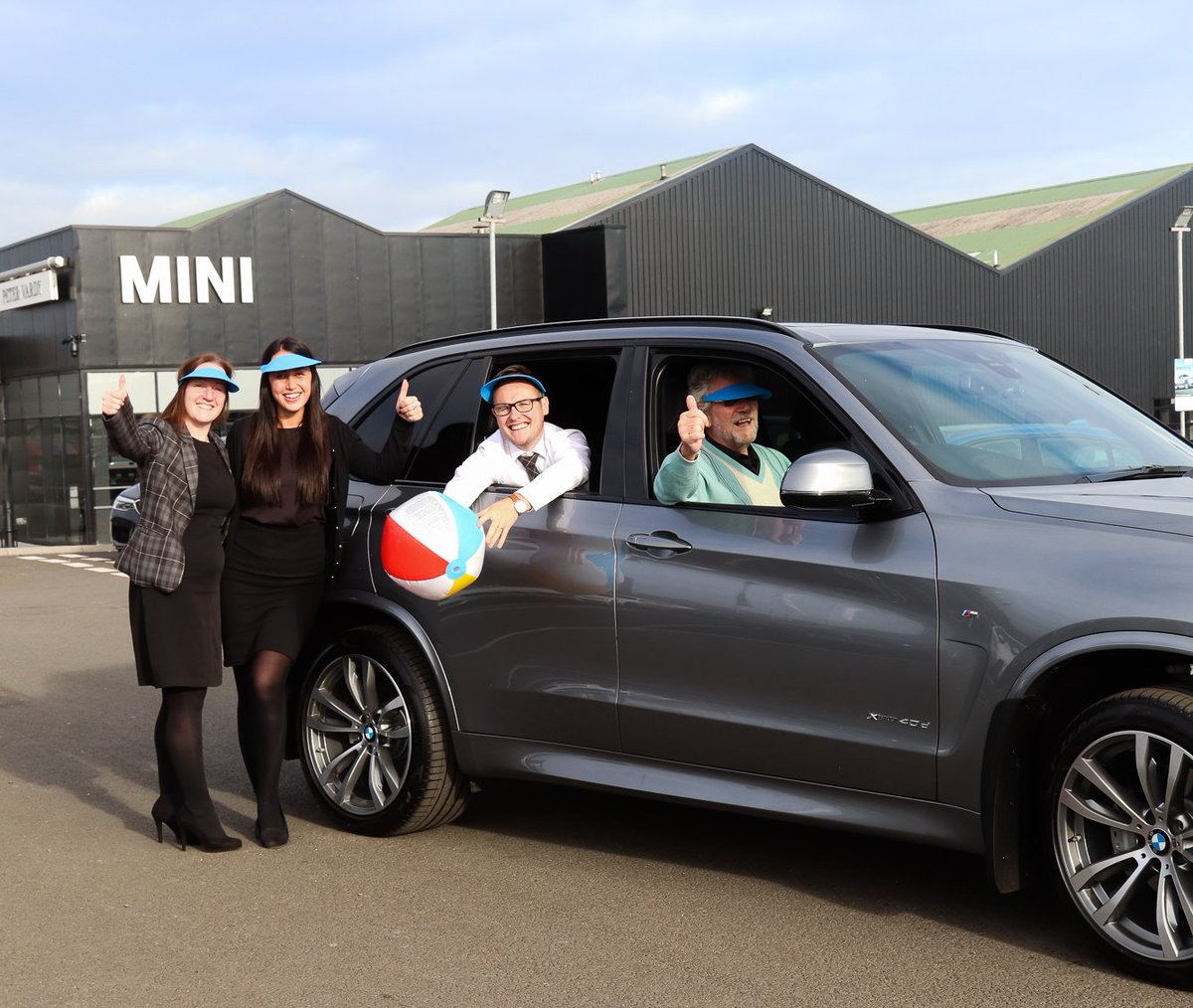 PeterVardyBMW's tweet photo. Mr Heron visited the dealership today for his second handover with the genius team. As he is going on holiday tomorrow, we bought him some beach balls and caps for his family and set his music up on his brand new BMW X5! #guestfactor #petervardybmw https://t.co/0YulFdyKLU