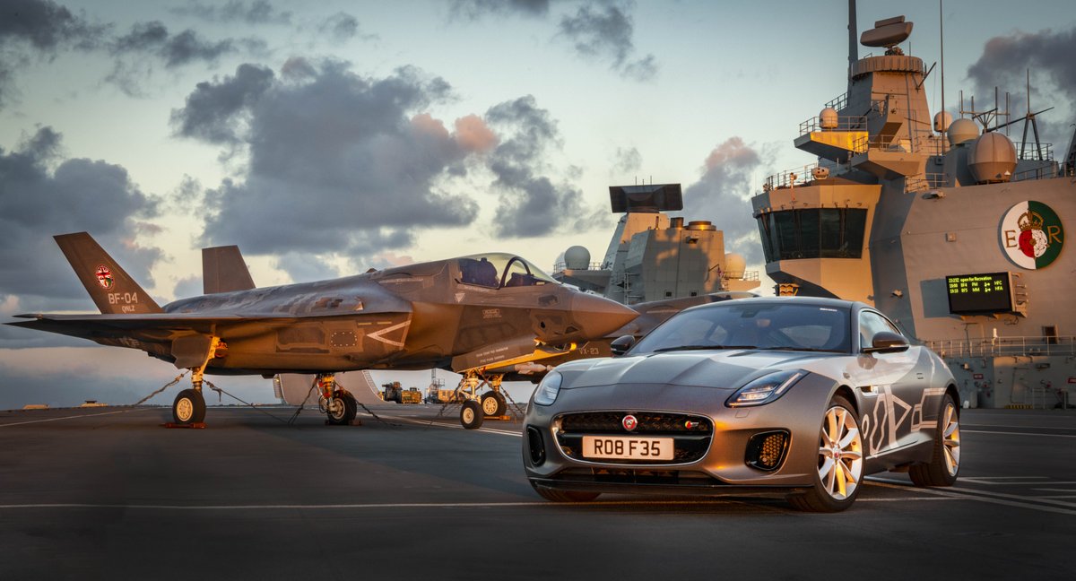 MarcusReports's tweet photo. When I flew out to the UK's Queen Elizabeth aircraft carrier a few weeks ago, the ship's captain nonchalantly told me they had an F-TYPE @Jaguar in the hangar below. Well here it is on the flight deck alongside an F-35 Joint Strike Fighter @HMSQnlz Photo: @LockheedMartin https://t.co/YqV6PrA64I