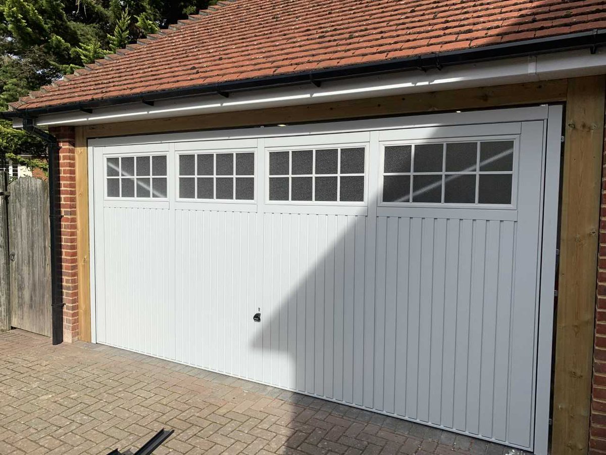 wolverinegarage's tweet photo. Here is a during and after photograph of a #Garador Salisbury double retractable 
door recently installed in #Wokingham. Finished in RAL7035 Light Grey. We think it looks lovely and so did our customer :) #Garagedoors #Reading #Berkshire https://t.co/zAaoeChudZ