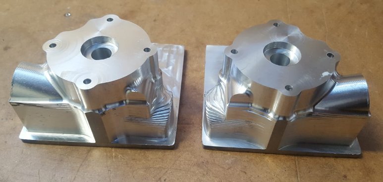 Op 1 completed on both swivels for our new <a href="/Greenpowertrust/">Greenpower Education Trust</a> F24+ car.  Tried a different roughing strategy for the left side that reduced cycle time down to 90 minutes.  Quite a few more hours to go before complete.  #Engineering #apprenticeships #cnc