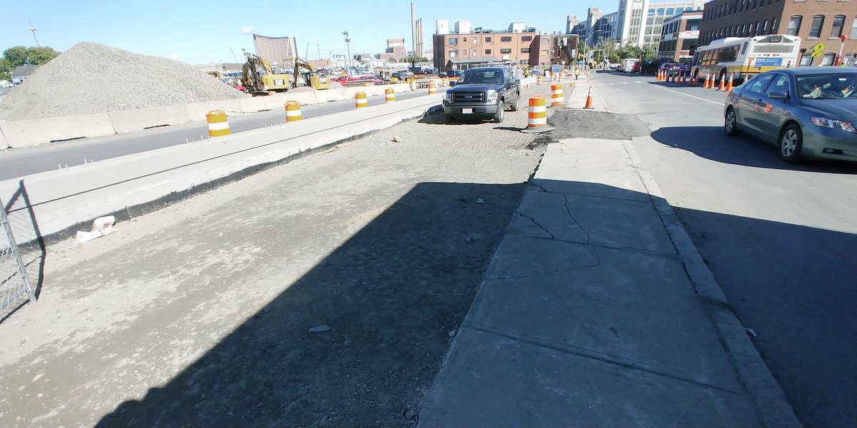 Fara1's tweet photo. Here's the scene on the southern side of #SullivanSquare today. They closed the entire sidewalk, so you have to basically battle a highway offramo, four car lanes and a bike lane to go anywhere. It's the wild west. Someone is going to get hurt. #MBTA #Boston #Somerville #Everett https://t.co/CiFpib4iWP