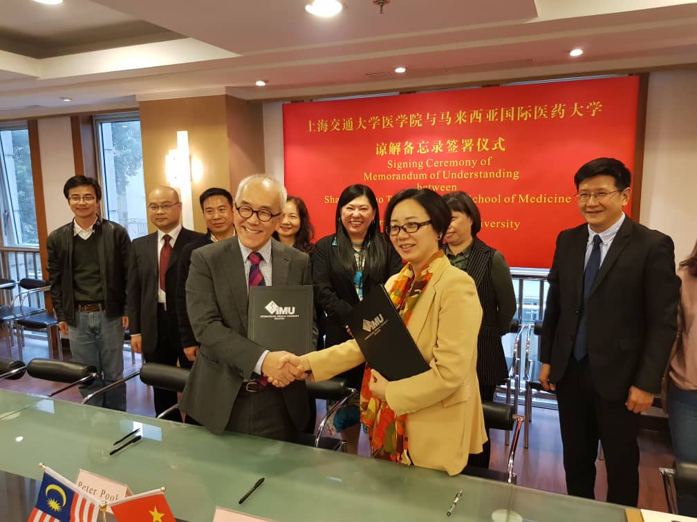 PookPeter's tweet image. MoU signed between IMU and Shanghai Jiao Tong University for collaboration including research and student exchange.