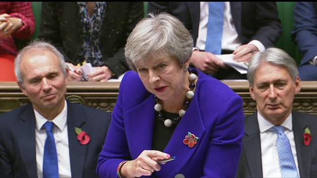 bbcmerseyside's tweet photo. The Prime Minister's appeared in the Commons wearing a ceramic poppy made by children from a #Liverpool school for sensory impairment.  @theresa_may appeared at Prime Minister's Question time with the broach from @StVincentsL12 in West Derby. https://t.co/npKZDJXx6u