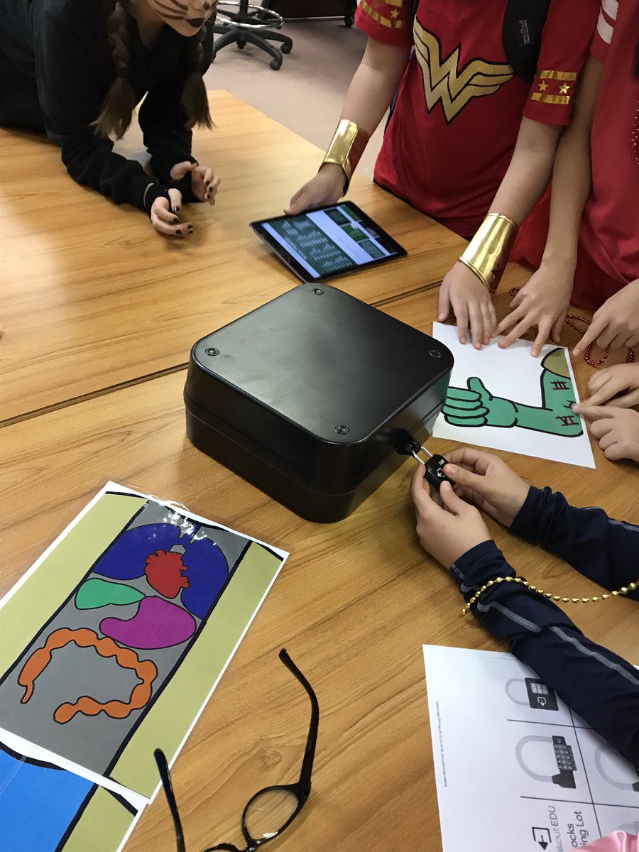 Students collaborating to complete a <a href="/breakoutEDU/">Breakout EDU</a> #HappyHalloween #pvpantherpride