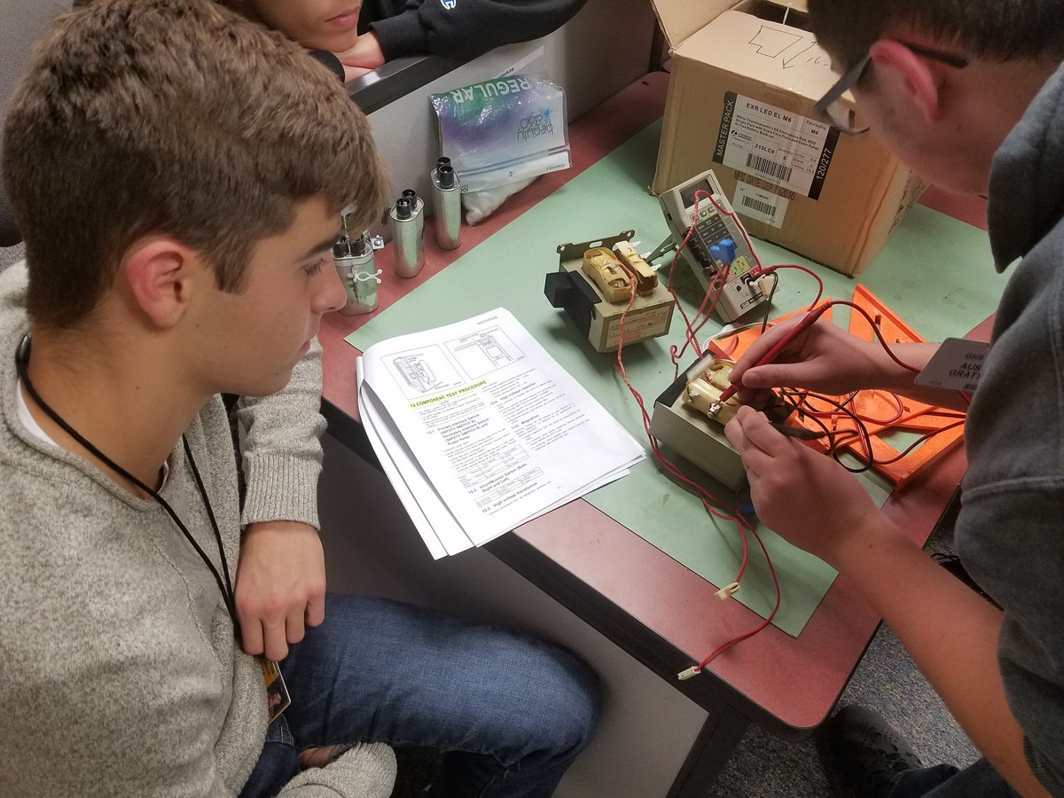 GHSEngineerTech's tweet photo. Gathering info from @GoshenSchools electrician, JW, about a commercial microwave that needs repaired. Research first, then testing spare parts JW brought us before we even begin troubleshooting the microwave. #YouDontGetThisLearningFromATextbook #EngagedProblemSolvers #EngDesDev https://t.co/JwxKmTQ5nW