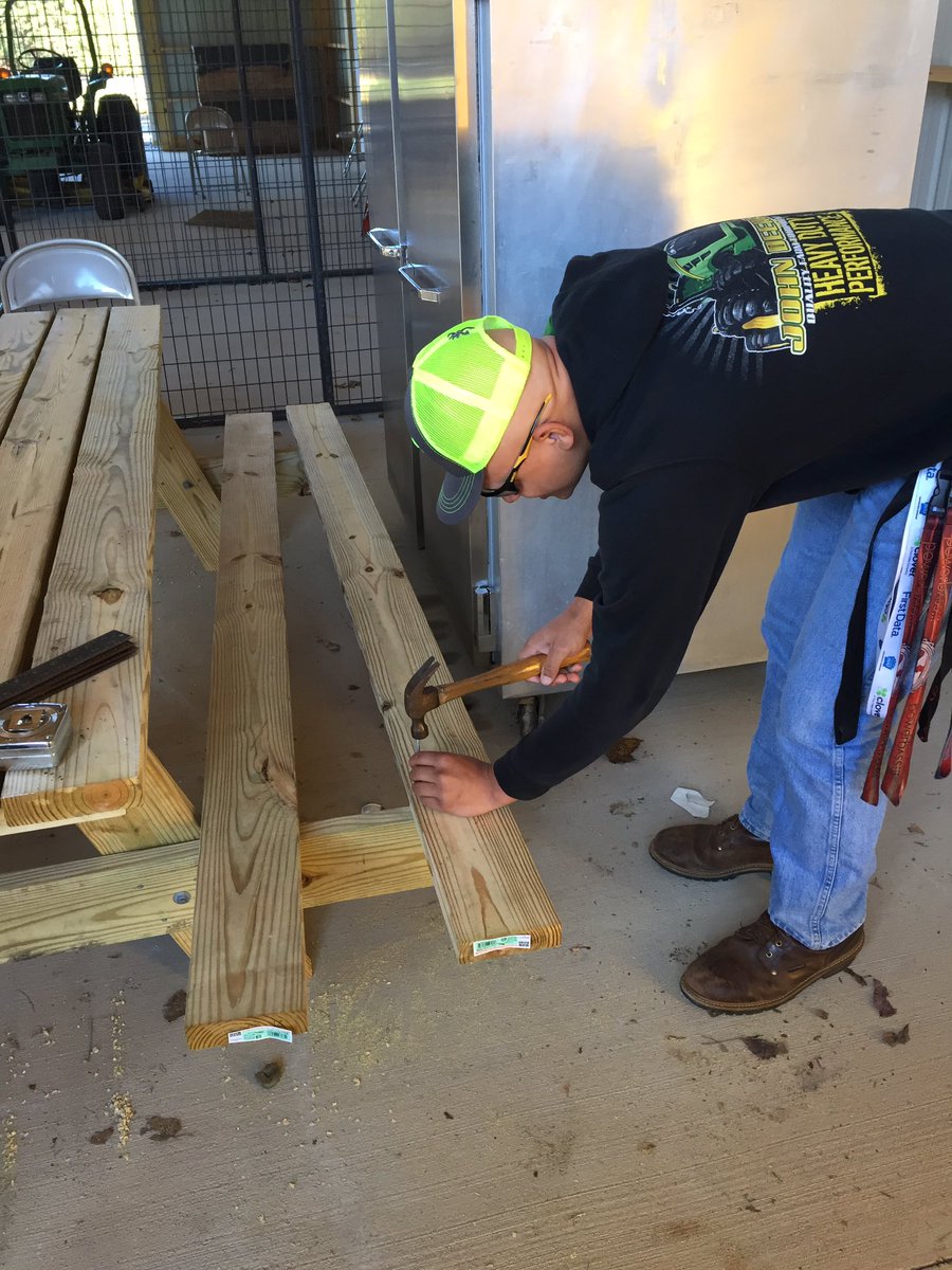 MinterJr's tweet photo. Forestry students at the Career Academy putting the final touches on the picnic tables for @RichAcresElem #HCPSLearning https://t.co/3x8gLdyJcB