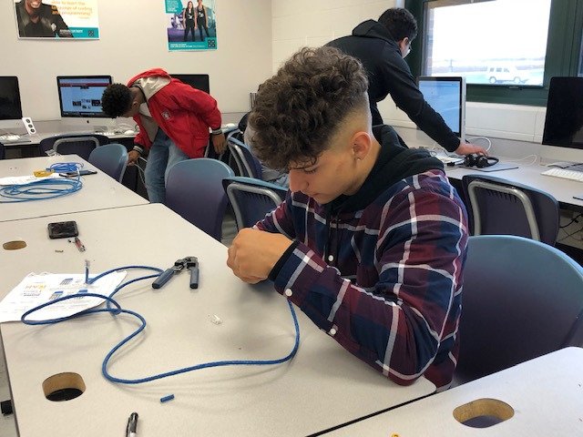 Kathy__Tyler's tweet photo. Students in Computer Maintenance are making ethernet cables for use around the district.  The majority of ethernet cables in labs and classrooms are student made! https://t.co/TPm1zacizf