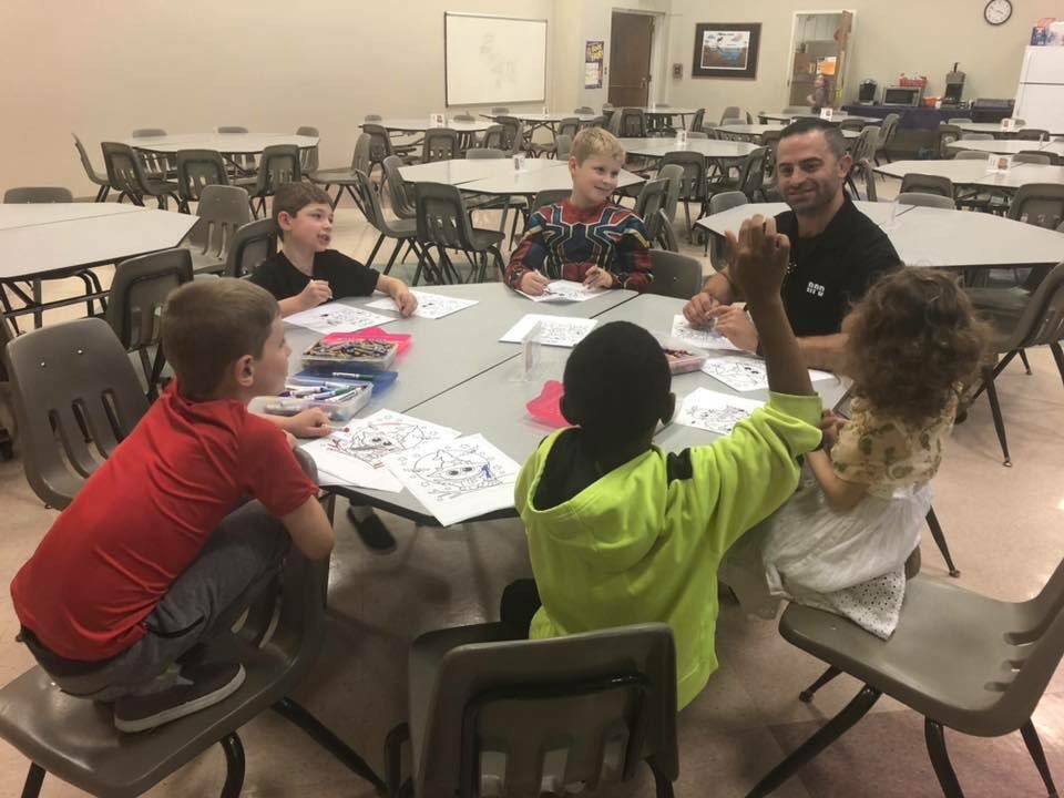 roanokepolice's tweet photo. Officer N. Comas had a great time at today’s #RPDHomeworkHelpers at Morningside Elementary! We helped with homework, colored some spooky pictures and talked about Halloween safety. https://t.co/AoGeT9hqTm