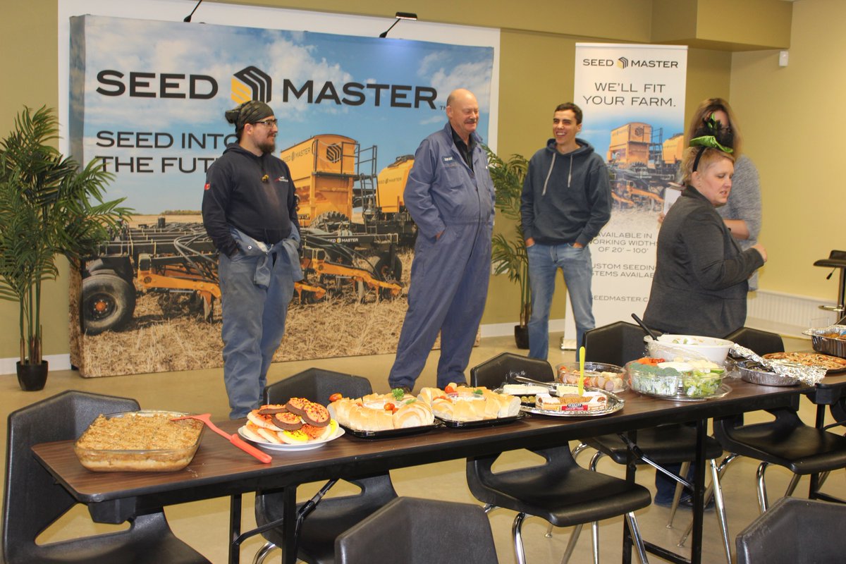SeedMasterMfg's tweet photo. We took time to enjoy a Halloween potluck at the office. You know what they say about all work and no play! We are grateful for the hard work farmers put in this harvest that allows us to put food like this on our table. #agribusiness #teamseedmaster #goodeats #CdnAg #Farmers https://t.co/tzTgqPOBzc