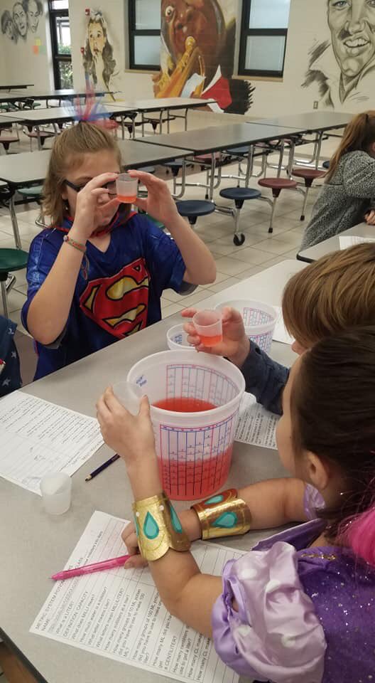 4amcculloch's tweet photo. Who says you can’t learn on a holiday? Mrs Godwin’s 6th graders Making and measuring "Halloween Potion"... Liters/mL https://t.co/g6d31iCTrA