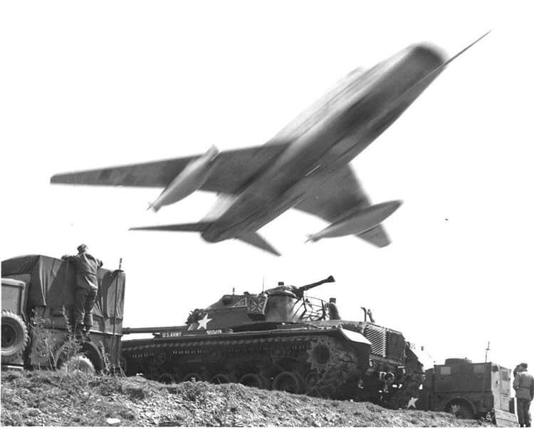 AgueraMartin's tweet photo. Blast from the past: One of the coolest action shots ever - an F-100 Hun of 50th TFW #HahnAirBase (where I grew up) during an exercise at #Wheelus AB, ca. 1961-64. That's what you call a low pass! 💪🇺🇸Amazing photo from @starsandstripes. @G_Steuer #USAF #FighterPilot #MasterofSky https://t.co/Amm0iAc4c2