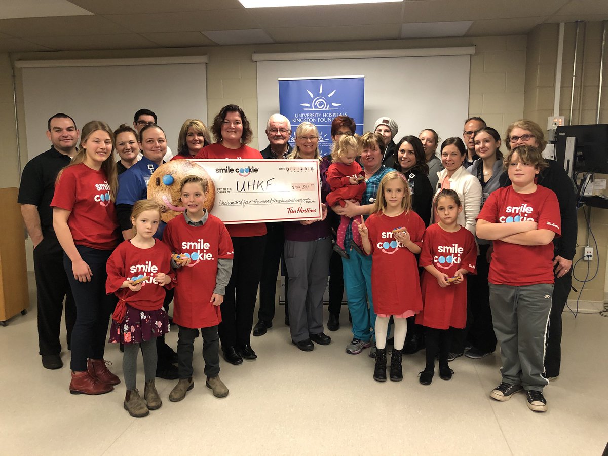 @agnewfoods @KtownTimmy @MyTimHortons and other local Tim Horton owners pose with the @KingstonHSC staff and former patients with this years total from #SmileCookies of $108,391 for the #NICU @TimHortons