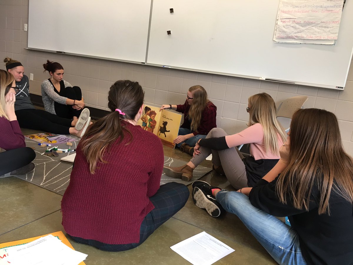 CentralCollEd's tweet image. Education majors engaging their “students” in a shared reading experience on the carpet.