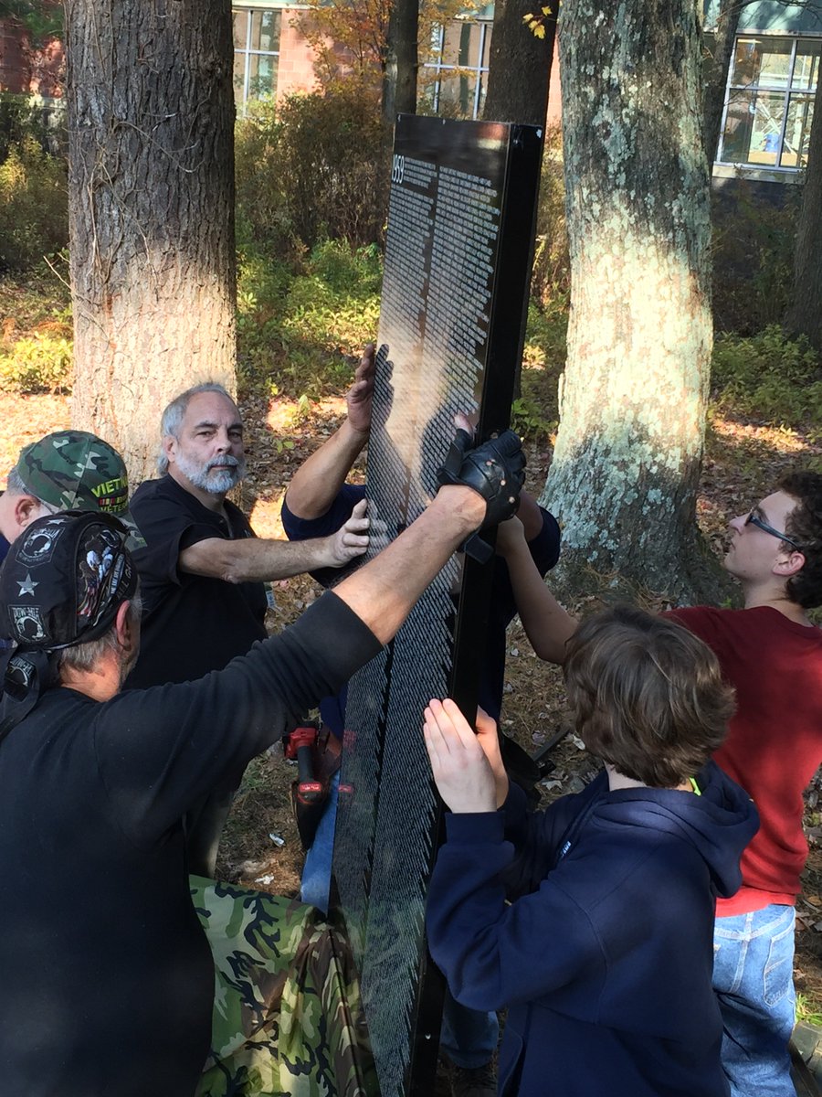 Ponaganset students, staff &amp; Vietnam vets begin assembling the Moving Wall. The Wall is open to the public all weekend. #PonagansetPride facebook.com/Bringthevietna…