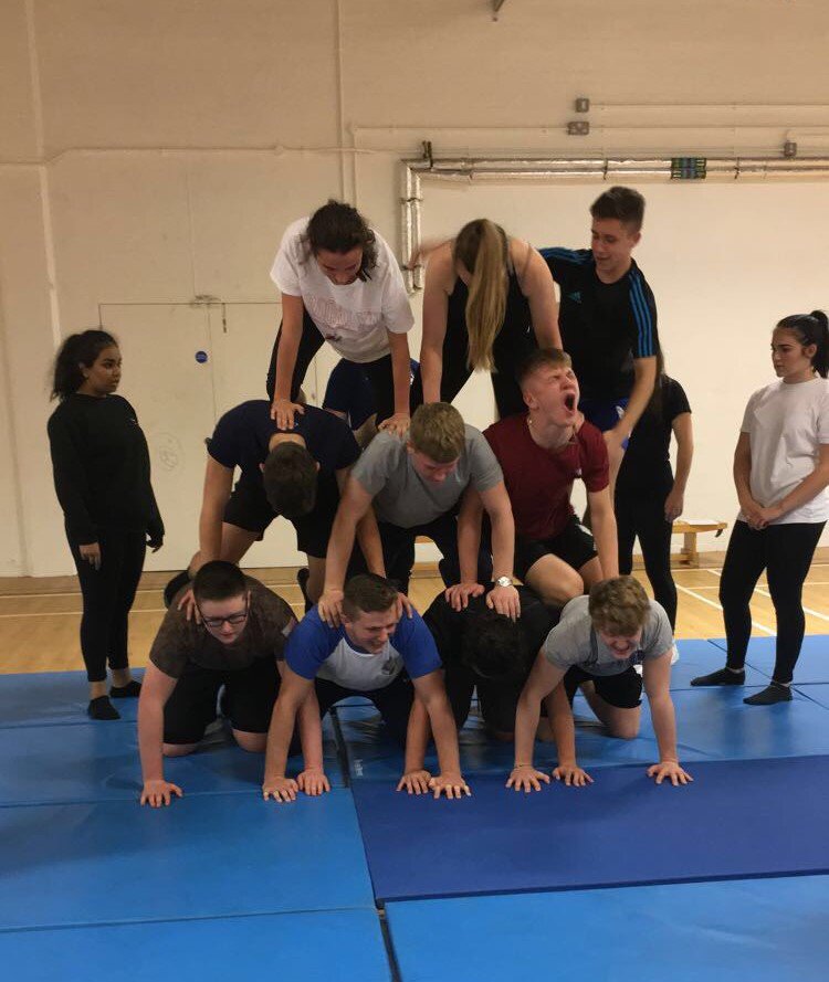 LouCollPService's tweet photo. Students building a human pyramid under the guidance of lecturer, qualified gymnastics instructor and Blue Peter Badge holder Fiona.
#bluepeter60 #PublicServices https://t.co/NOamyySSeE