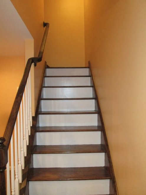 Pretty remarkable how we went from regular #basement stairs to a railing, and steps with a very refined looking stain. And the balusters and risers in this #OxfordCT home are glowing with their new white finish. #connecticut #BASEMENTCAVE #homerenovation betterbuiltbasements.com