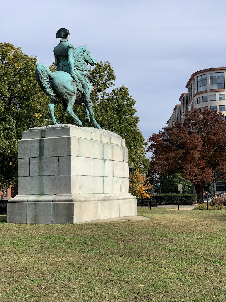 A statue of George Washington looking over Washington Circle