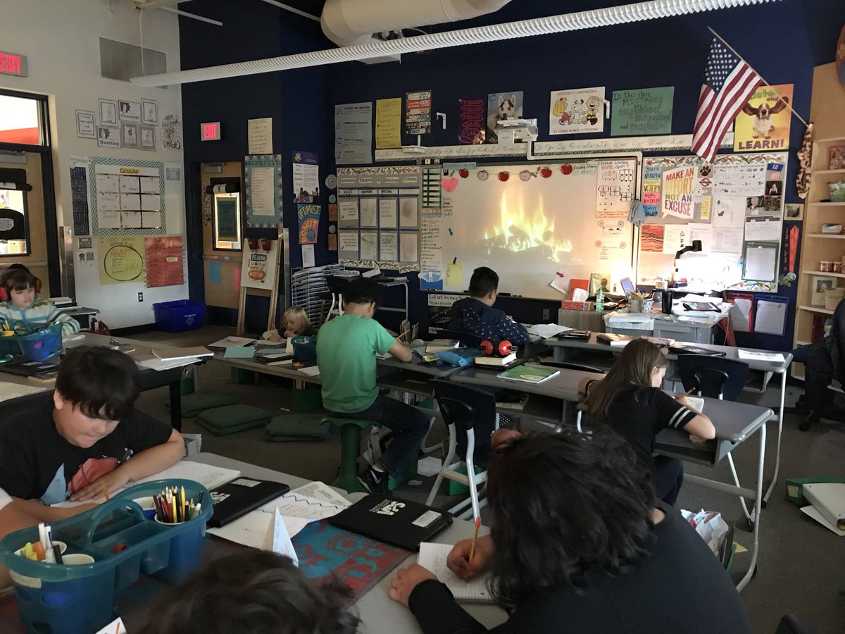 MrsBriem's tweet image. Cozying up and writing by the “fire” on the first of November. 🍁🍂 #huskylearning #pawesome @Wash_HuskiesVPS