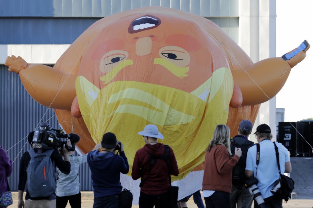 latimes's tweet photo. "Baby Trump" balloon flies over downtown Los Angeles https://t.co/VXOj9LslJL https://t.co/l8HTd9gNfE