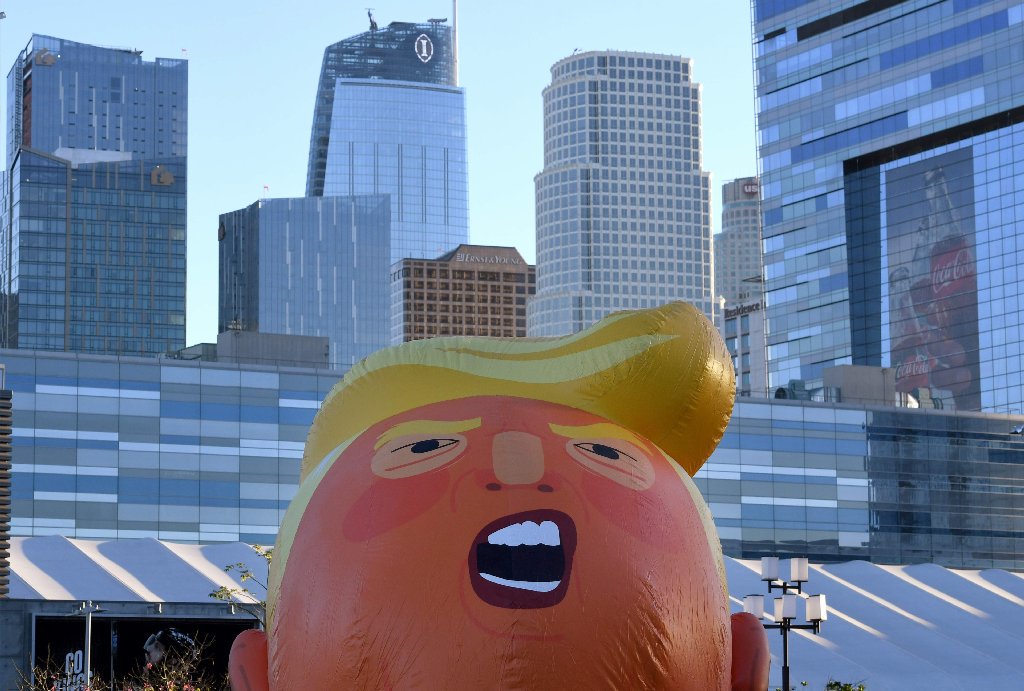 latimes's tweet photo. "Baby Trump" balloon flies over downtown Los Angeles https://t.co/VXOj9LslJL https://t.co/l8HTd9gNfE