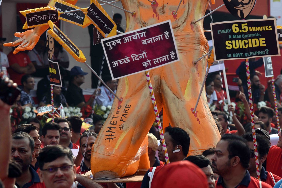 TOIDelhi's tweet photo. A demonstration by various awareness groups demanding #gender neutral laws during Airtel Delhi half marathon at Jawaharlal Nehru Stadium in New Delhi. 
Photos: @Piyaltimes https://t.co/jJTYRvEncP